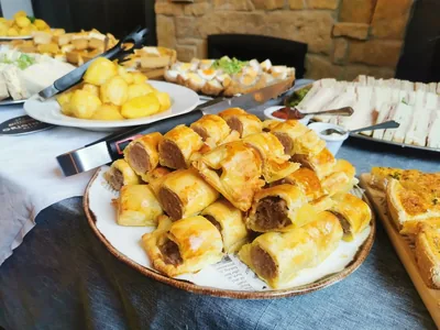 Platters of buffet food laid out for a gathering at the pub